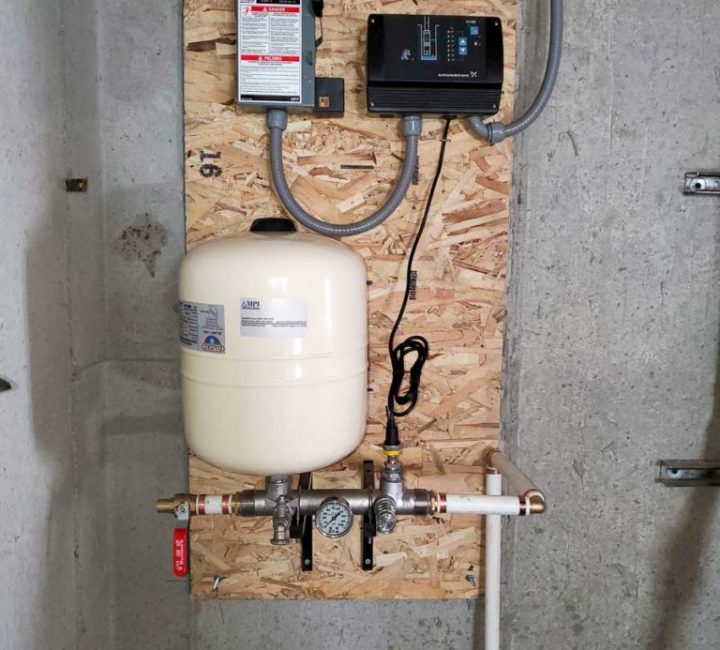 Water well pump system in garage